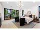 Spacious main bedroom with an abundance of natural light and a view of trees at 1126 S Garfield St, Denver, CO 80210