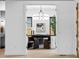 Elegant office space with a unique chandelier, large window, and stylish decor at 1126 S Garfield St, Denver, CO 80210
