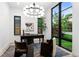 Bright office with ample natural light, a modern chandelier, and views of the outdoors at 1126 S Garfield St, Denver, CO 80210