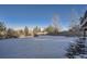 Large backyard with playset and snowy landscape at 415 S Snowmass Cir, Superior, CO 80027