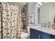 Clean bathroom with tub/shower combo, updated vanity, and stylish decor at 415 S Snowmass Cir, Superior, CO 80027