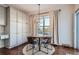 Kitchen breakfast nook with a charming wooden table and four leather chairs at 415 S Snowmass Cir, Superior, CO 80027