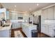 Spacious kitchen featuring granite countertops, stainless steel appliances, and a large island at 415 S Snowmass Cir, Superior, CO 80027