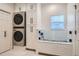 Laundry room with built in cabinets and dog washing station at 415 S Snowmass Cir, Superior, CO 80027