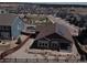 Lovely aerial view of a modern single-Gathering home with solar panels in a suburban neighborhood at 1297 Black Haw St, Elizabeth, CO 80107