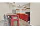 Finished basement wet bar features red cabinetry, butcher block counters, and floating shelves at 1297 Black Haw St, Elizabeth, CO 80107