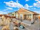 This property offers desert landscaping in the front yard, a covered porch, and a homey design at 1297 Black Haw St, Elizabeth, CO 80107