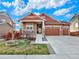 Charming single-Gathering home with a well-maintained front yard, inviting porch, and a three car attached garage at 1297 Black Haw St, Elizabeth, CO 80107