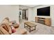 Cozy living room with a large TV, fireplace, and comfortable seating, creating an inviting atmosphere at 1297 Black Haw St, Elizabeth, CO 80107