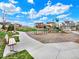 Gathering-friendly neighborhood playground with swings, slides, and benches for relaxation, surrounded by sidewalks and green space at 1297 Black Haw St, Elizabeth, CO 80107