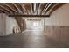 Unfinished basement featuring exposed beams and concrete flooring, perfect for future renovation at 15851 Josephine Cir, Brighton, CO 80602