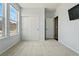 Comfortable bedroom featuring plush carpeting, a large window for natural light, and a spacious closet at 15851 Josephine Cir, Brighton, CO 80602