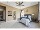 Cozy bedroom with a comfortable bed, soft carpet, and ensuite bathroom access at 15851 Josephine Cir, Brighton, CO 80602