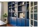 This office features custom built-in shelving and cabinetry, perfect for storage and organization at 15851 Josephine Cir, Brighton, CO 80602