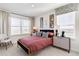 Cozy bedroom with natural light, stylish decor, and modern furnishings at 18714 E 99Th Ave, Commerce City, CO 80022