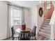 Cozy breakfast nook area with table, chairs, and natural light streaming through the window at 18714 E 99Th Ave, Commerce City, CO 80022