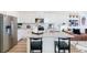 Modern kitchen features stainless steel appliances, granite countertops, and white cabinetry at 18714 E 99Th Ave, Commerce City, CO 80022