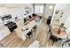 Open-concept living space showcasing the kitchen, living room, dining area, and bathroom at 18714 E 99Th Ave, Commerce City, CO 80022