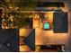 Aerial view of backyard with hot tub, patio, outdoor kitchen, and fire pit at 2400 S Columbine St, Denver, CO 80210