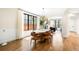 Bright dining room with modern light fixture, hardwood floors, and large windows at 2400 S Columbine St, Denver, CO 80210