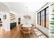 Elegant dining room with modern chandelier, wainscoting, and large window at 2400 S Columbine St, Denver, CO 80210