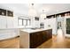 Spacious kitchen with a large island, modern appliances, and hardwood floors at 2400 S Columbine St, Denver, CO 80210
