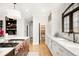 Elegant kitchen with stainless steel appliances, a kitchen island and a large window above the sink at 2400 S Columbine St, Denver, CO 80210