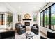 Cozy living room with fireplace, large windows, and comfortable seating at 2400 S Columbine St, Denver, CO 80210
