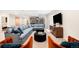 Modern living room with a large sectional sofa, two black coffee tables and stylish decor at 2400 S Columbine St, Denver, CO 80210