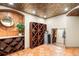 Unique wine cellar with terracotta tile floor, diamond paneled wine racks and decorative tin ceiling at 2400 S Columbine St, Denver, CO 80210