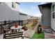 Backyard featuring a small stone path, wood and metal fence, and a seating area at 8984 Eagle River St, Littleton, CO 80125