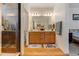 Bathroom with double vanity and a large mirror at 8984 Eagle River St, Littleton, CO 80125