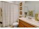 Bathroom with shower/tub combo and updated vanity at 8984 Eagle River St, Littleton, CO 80125