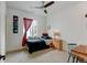 Bedroom featuring carpet, modern lighting, a window with a curtain and a workspace at 8984 Eagle River St, Littleton, CO 80125