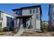 Two-story modern home with gray siding and a front porch at 8984 Eagle River St, Littleton, CO 80125