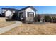 Charming outdoor structure with stone accents and a well-maintained lawn, ideal for relaxation at 8984 Eagle River St, Littleton, CO 80125