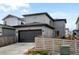 Two-car garage with modern door at 8984 Eagle River St, Littleton, CO 80125