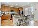 Modern kitchen with stainless steel appliances, granite countertops, and a central island at 8984 Eagle River St, Littleton, CO 80125