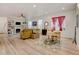 Spacious living room with a fireplace, built-in shelves, and hardwood floors at 8984 Eagle River St, Littleton, CO 80125