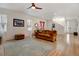 Living room with a fireplace, built-in shelves, and hardwood floors at 8984 Eagle River St, Littleton, CO 80125