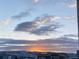 Picturesque view of a sunset over the mountains from the house at 8984 Eagle River St, Littleton, CO 80125