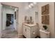Clean, modern bathroom with stylish fixtures, a vanity with storage, and contemporary wall art at 920 W 128Th Pl, Westminster, CO 80234