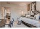Stylish secondary bedroom with modern workstation and views into modern kitchen at 920 W 128Th Pl, Westminster, CO 80234