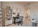 Stylized home office featuring built-in shelving, neutral decor, and plenty of natural light at 920 W 128Th Pl, Westminster, CO 80234
