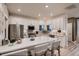 Well-lit kitchen with a spacious island, stainless steel appliances, and ample cabinet space at 920 W 128Th Pl, Westminster, CO 80234
