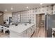 Kitchen featuring a large island with seating, stainless steel appliances, and modern design at 920 W 128Th Pl, Westminster, CO 80234