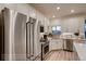 Modern kitchen featuring stainless steel appliances, bright cabinetry, and a view from the kitchen window at 920 W 128Th Pl, Westminster, CO 80234