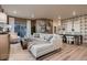 Open-concept living room with stylish decor, decorative wall art, and dining area, filled with natural light at 920 W 128Th Pl, Westminster, CO 80234