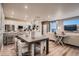 Open-concept living space seamlessly connects the kitchen, dining area, and living room at 920 W 128Th Pl, Westminster, CO 80234