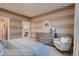 Comfortable bedroom with stylish accent chair and attractive natural wood dresser at 920 W 128Th Pl, Westminster, CO 80234